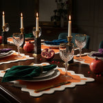 White and Orange 100% Linen Scallop Placemats - Set of 4 styled in a room setting