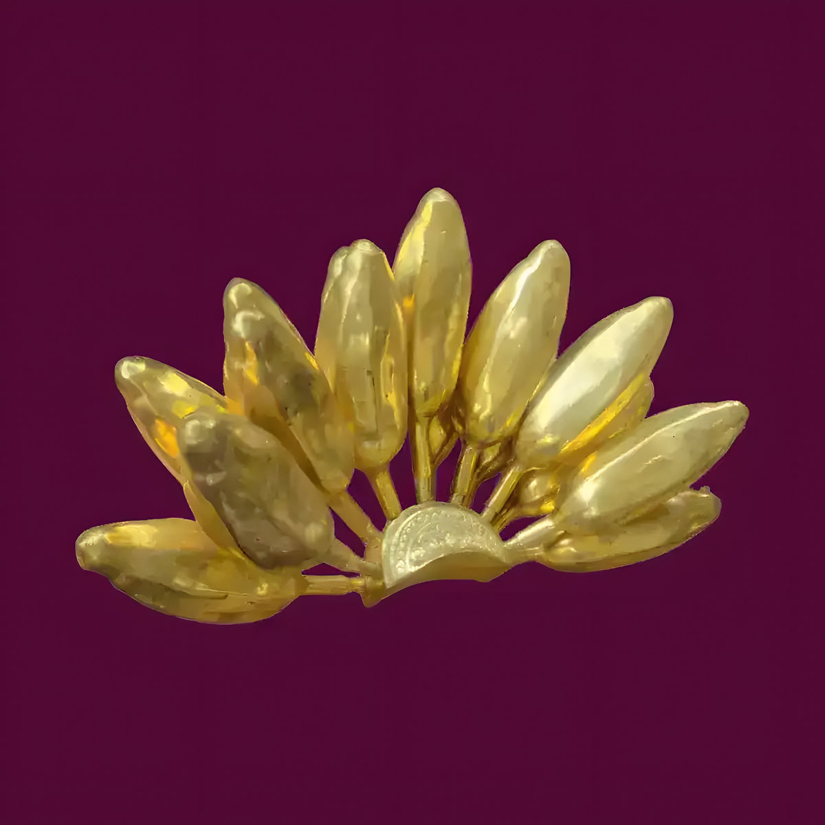 Shiny gold solid brass banana bunch decor, fan-shaped cluster of small bananas fanned outward, on deep purple background