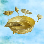 Gold brass 3D lotus legged bowl with engraved sides, lotus flower stems and carp fish inside on blue background