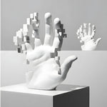 White artistic mosaic hand sculpture front view — open palm with fragmented pixelated cubic effect on fingers, studio grey bg