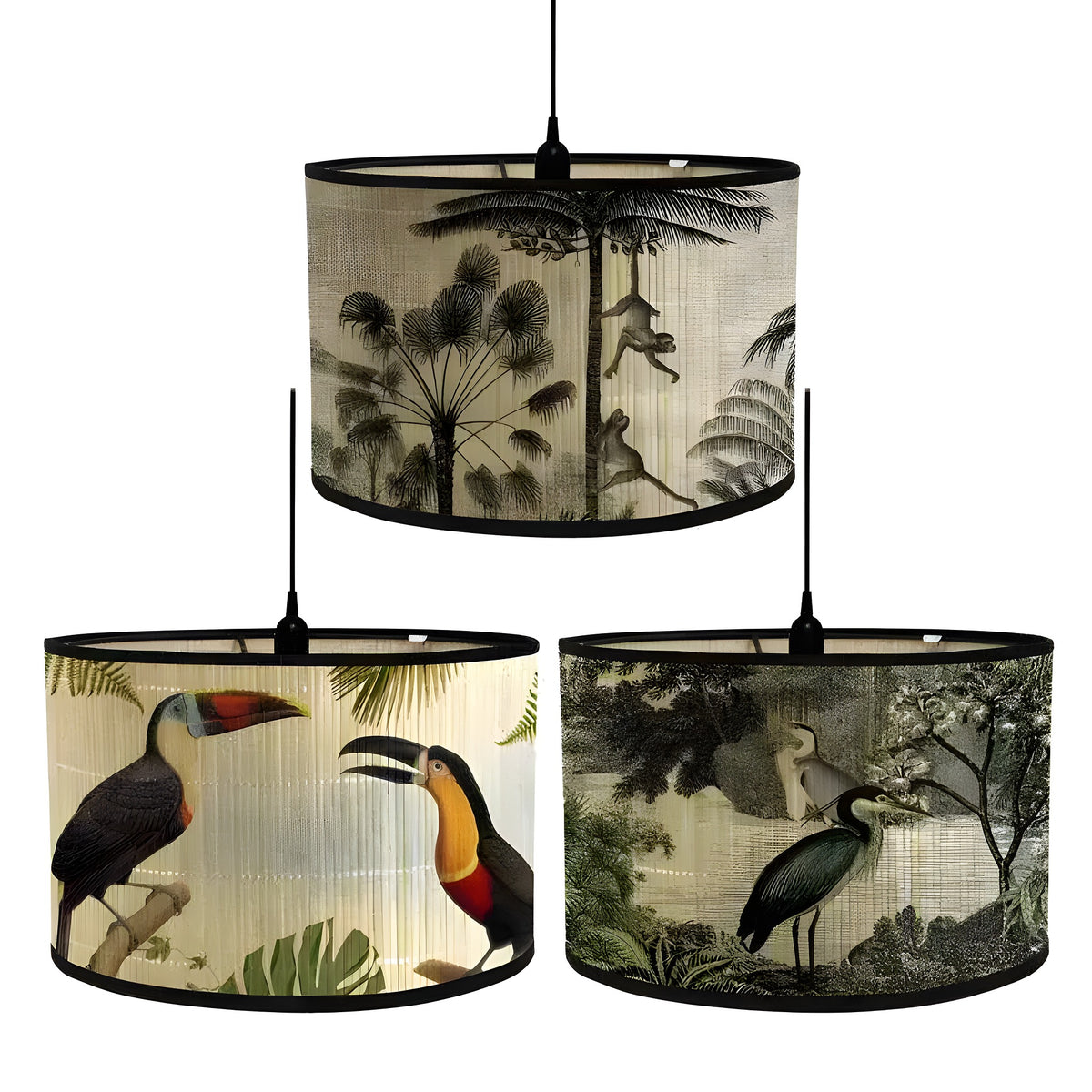 Three tropical paradise drum lampshades displayed hanging, featuring monkeys, toucans, and herons printed on natural fabric
