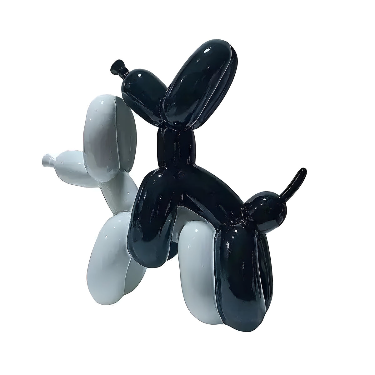 Two Make Love Balloon Dog sculptures in glossy black and white resin, intertwined upright on white background