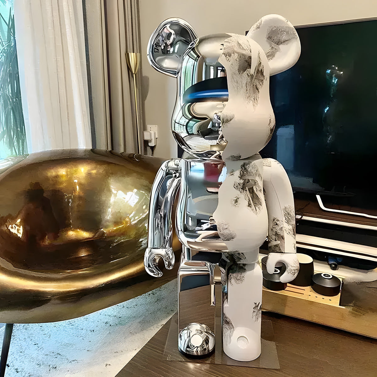 Standing bear figurine with chrome and white ink-wash mountain motif, displayed in modern living room setting