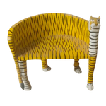 Yellow wooden tiger Maharaja chair with black stripe painted body and carved tiger head, angled front view