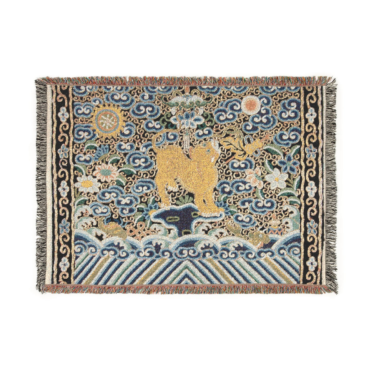 A square woven rug with fringed edges, featuring a central golden deer surrounded by blue and beige clouds, waves, floral motifs, and ornate border patterns on a white background.