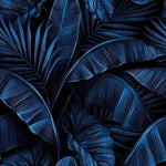 Electric blue tropical wallpaper with overlapping banana leaves and palm fronds in deep indigo tones