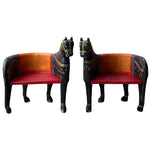Pair of hand crafted wooden horse Maharaja chairs with black carved body, gold trim, orange back and red seat