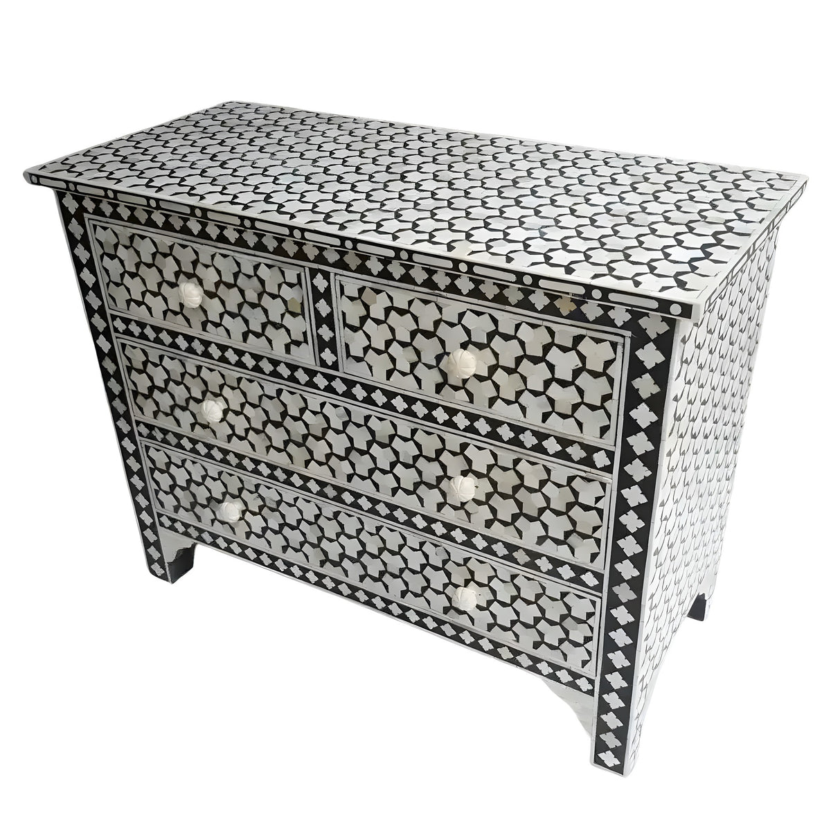 Targua bone inlay chest of 4 drawers, black ground with white star and quatrefoil mosaic pattern, brass circular knob pulls