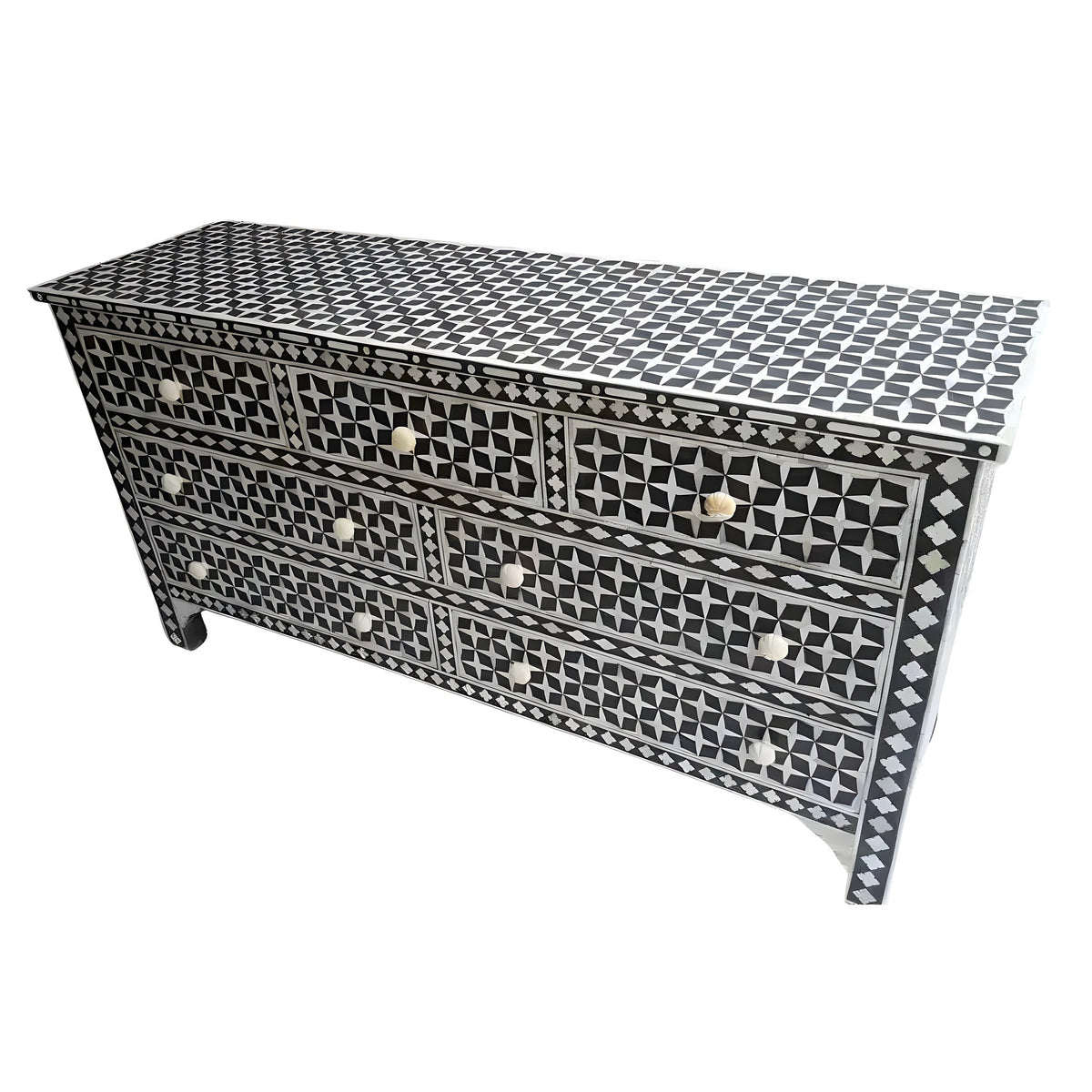 Pearl inlay 7-drawer chest — black ground with white geometric star and diamond mother-of-pearl inlay, white background