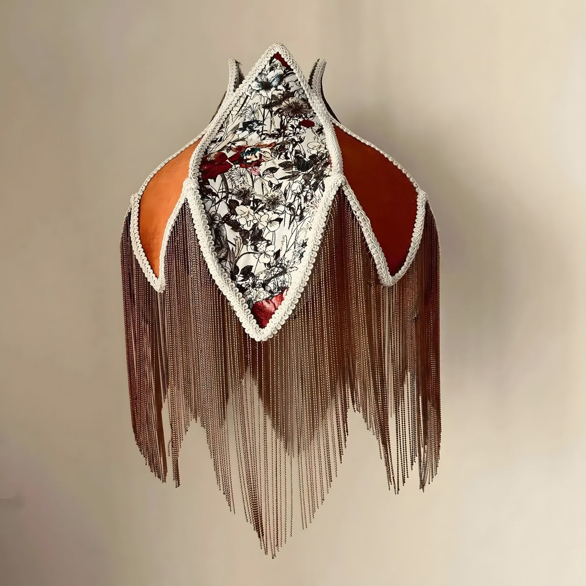 Wild Flower velvet lampshade in burnt orange tulip shape with long chain tassels, floral interior panel, and cream lace trim.
