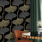 Golden Gingko Grove Wallpaper of gold and grey leaves on black with rust chair and green drape
