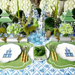 Lush lime delight placemats in bright green with white scalloped edge, styled at festive table with blue printed runner, nutcracker decor and green candles