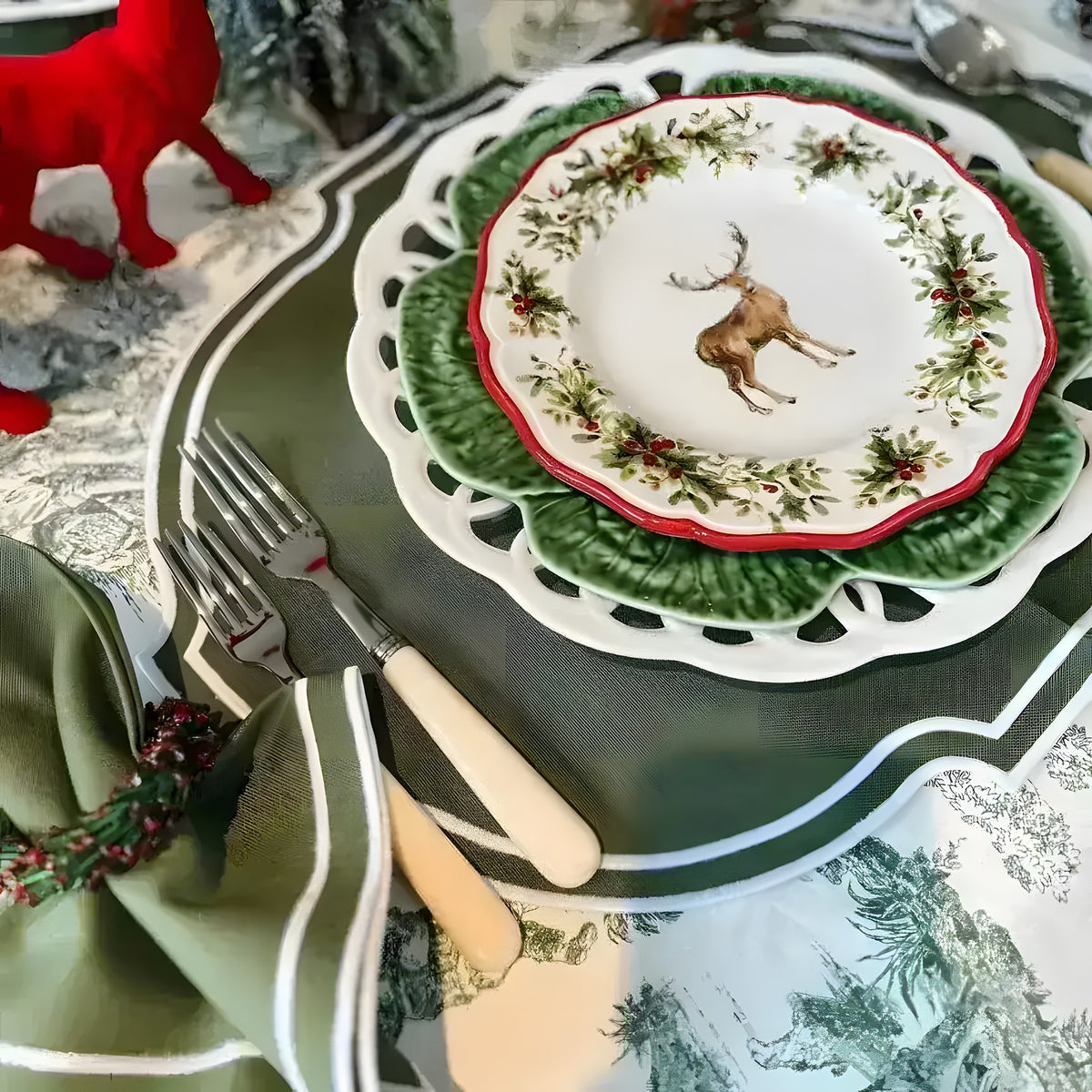 Olive Oasis Placemats olive-green scalloped-border placemat styled in festive table setting with deer china plates