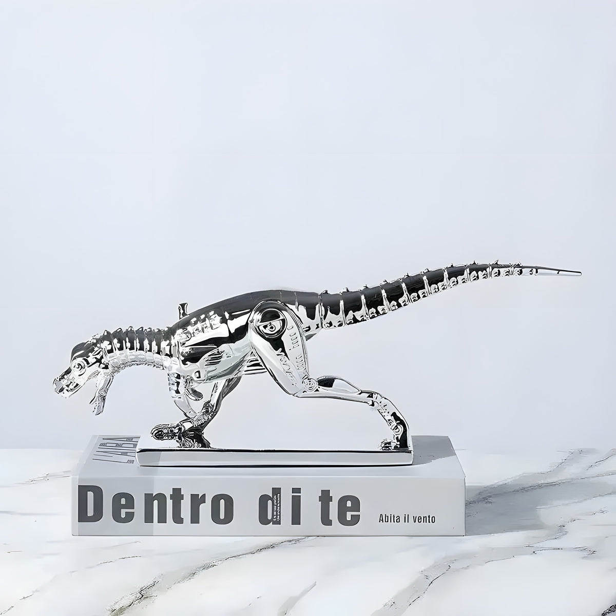 silver metallic Tyrannosaurus Rex Dinosaur Sculpture with skeleton detail on marble display base, side view