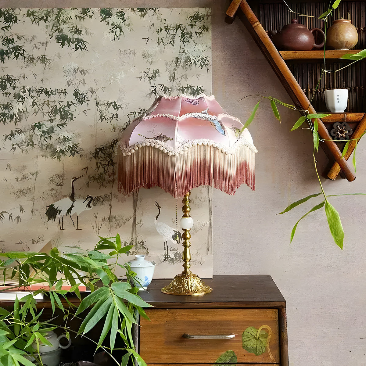 pink dome butterfly lampshade with long fringe tassels on ornate brass base styled in botanical room