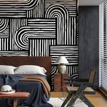 Modern bedroom with abstract black and white wall pattern