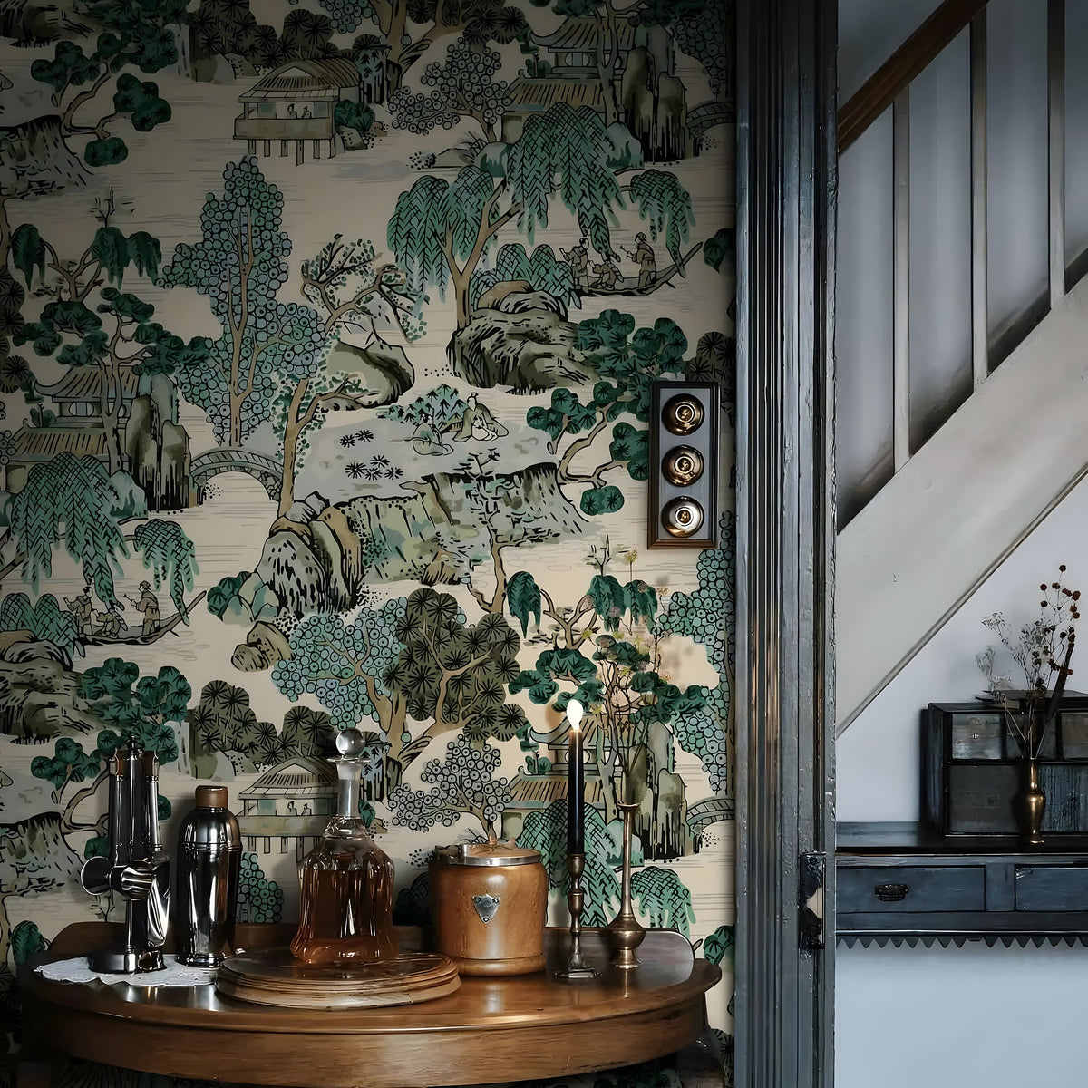 Decorative wallpaper with nature-themed design in a room with a wooden table and decorative items.