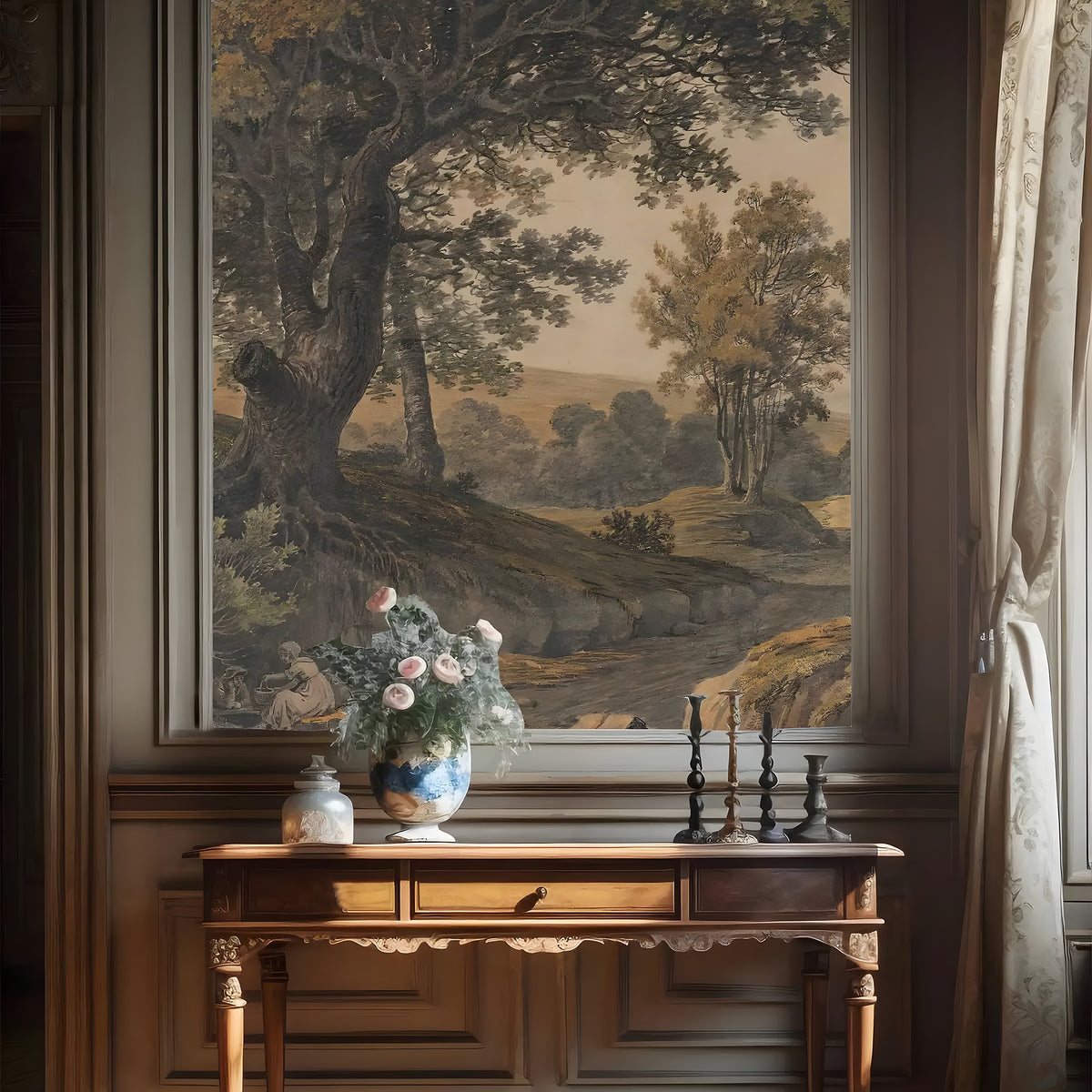 Wooden console table with decorative items against a wall with a large landscape painting.