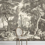 Decorative wallpaper with classical scene featuring ruins and figures, with a chair in front.