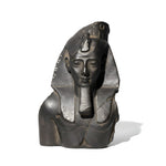 Bronze statue of a pharaoh with a headdress on a white background