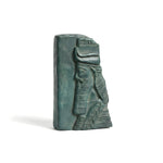 Bronze statue of a pharaoh with a headdress on a white background