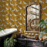 Vintage-style bathroom with yellow wallpaper featuring white birds, a mirror, and decorative elements.