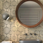 Bathroom with round wooden mirror, patterned wall, and modern fixtures.