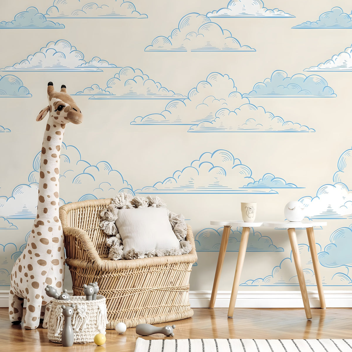 Children's room with cloud-patterned wallpaper, wicker chair, and stuffed giraffe.