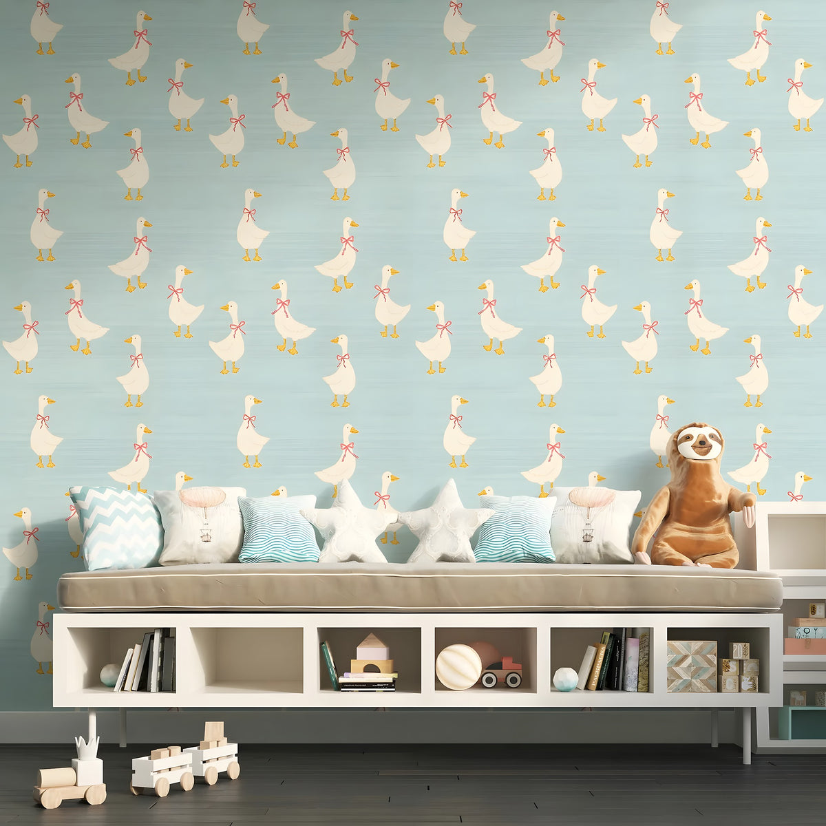 Children's room with a patterned wall, sofa, and toys.