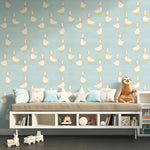 Children's room with a patterned wall, sofa, and toys.