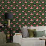 Living room with floral wallpaper, sofa, and decorative pillows.