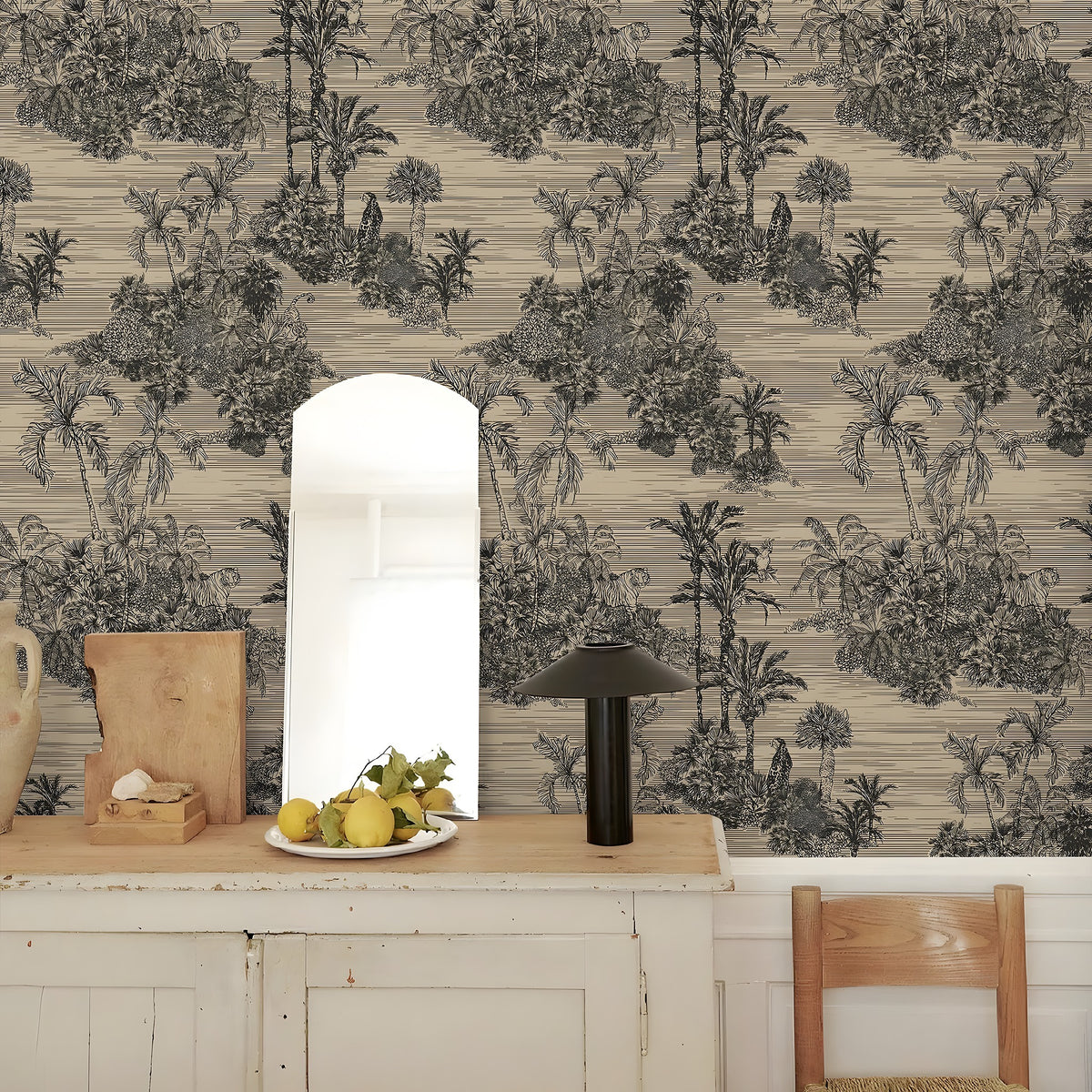 Room interior with a patterned wall, wooden table, and chair.