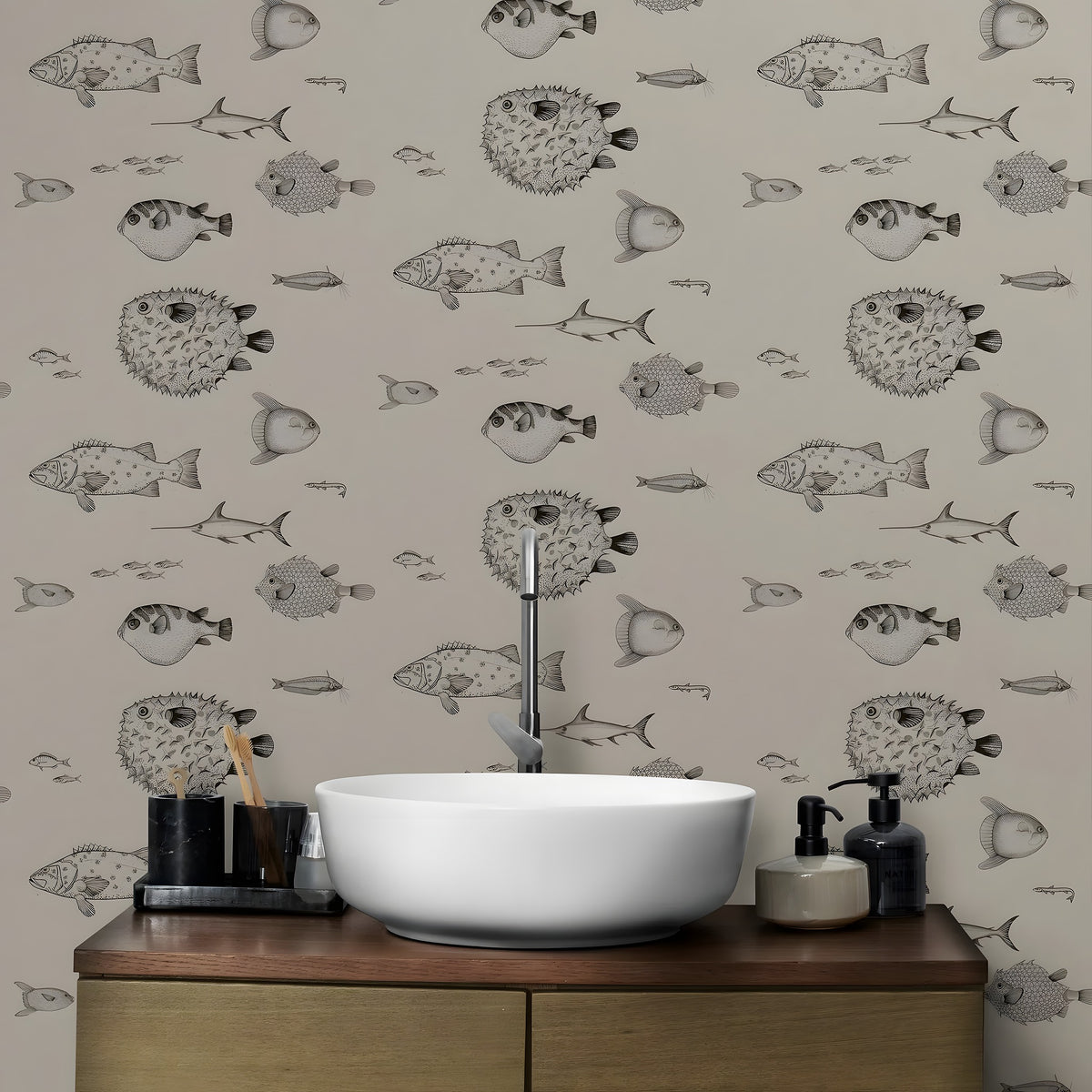 Bathroom with a wooden vanity, white sink, and fish-patterned wallpaper.