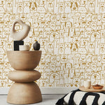 Decorative table with sculptures against a wallpaper with animal patterns