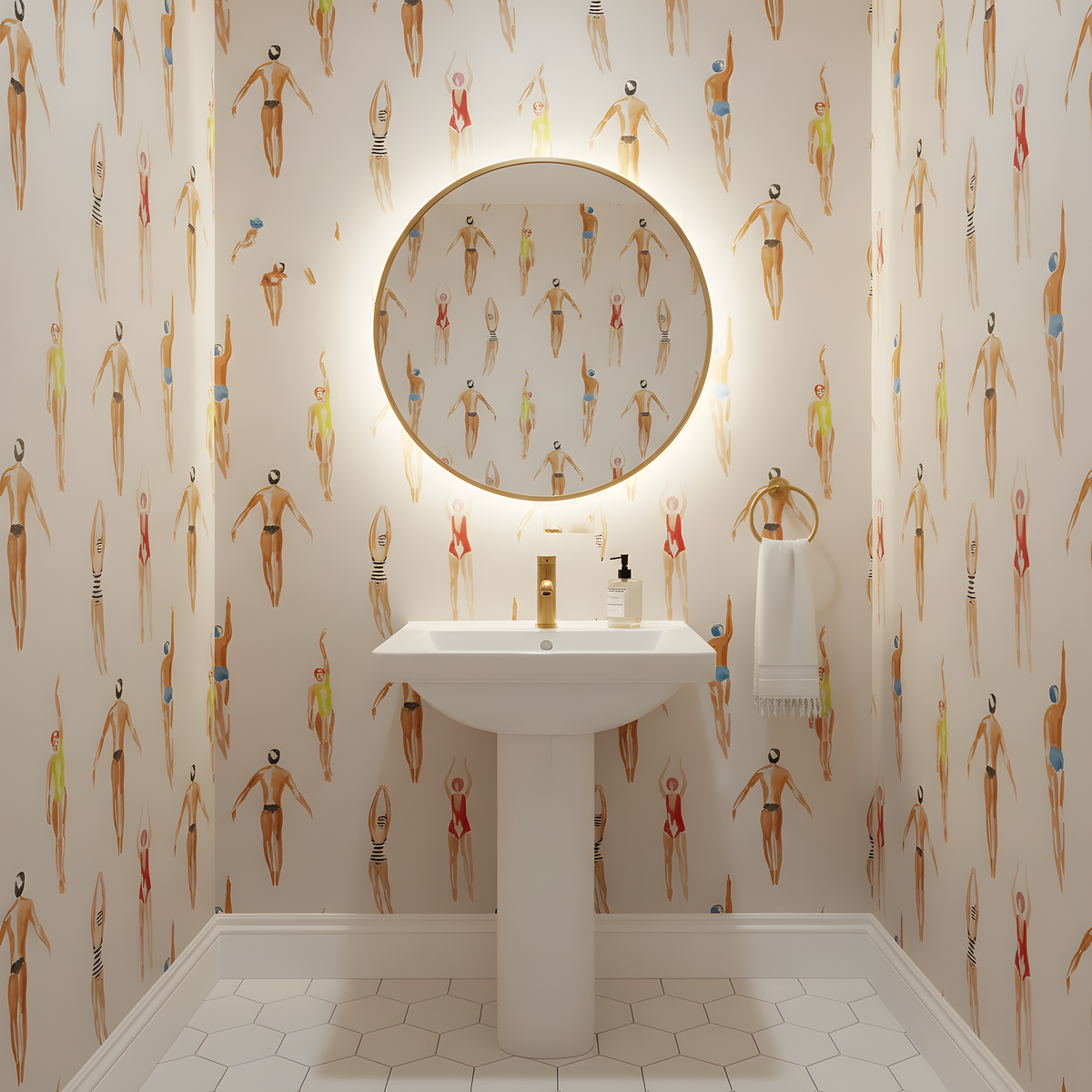 Bathroom with a pedestal sink and round mirror against a wall with swimmer patterned wallpaper.