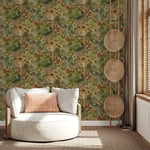 Modern white sofa against a floral wallpaper wall with decorative elements.