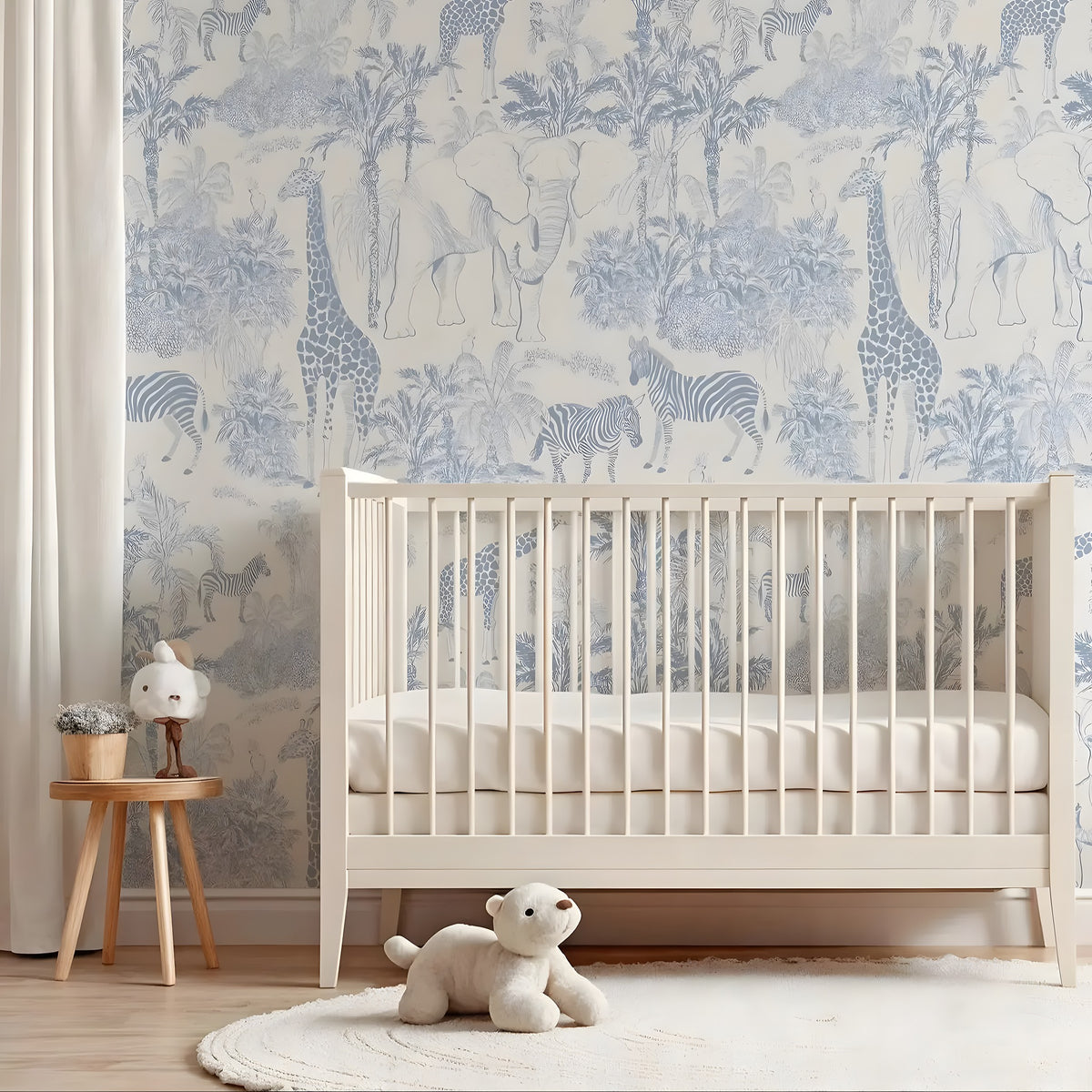 Nursery room with crib, teddy bear, and animal-themed wallpaper