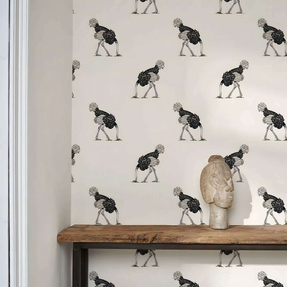 Wallpaper with a pattern of stylized figures on a neutral background, featuring a wooden shelf with a decorative item.