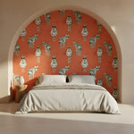 Bedroom with a red wall featuring zebra pattern and beige bed.
