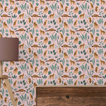Wallpaper with leopards and foliage pattern on a pink background