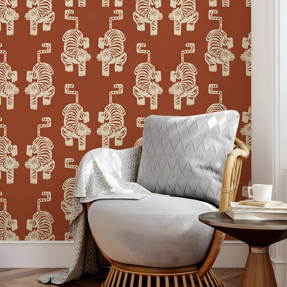 Gray armchair with a patterned wall featuring tiger designs in a room.