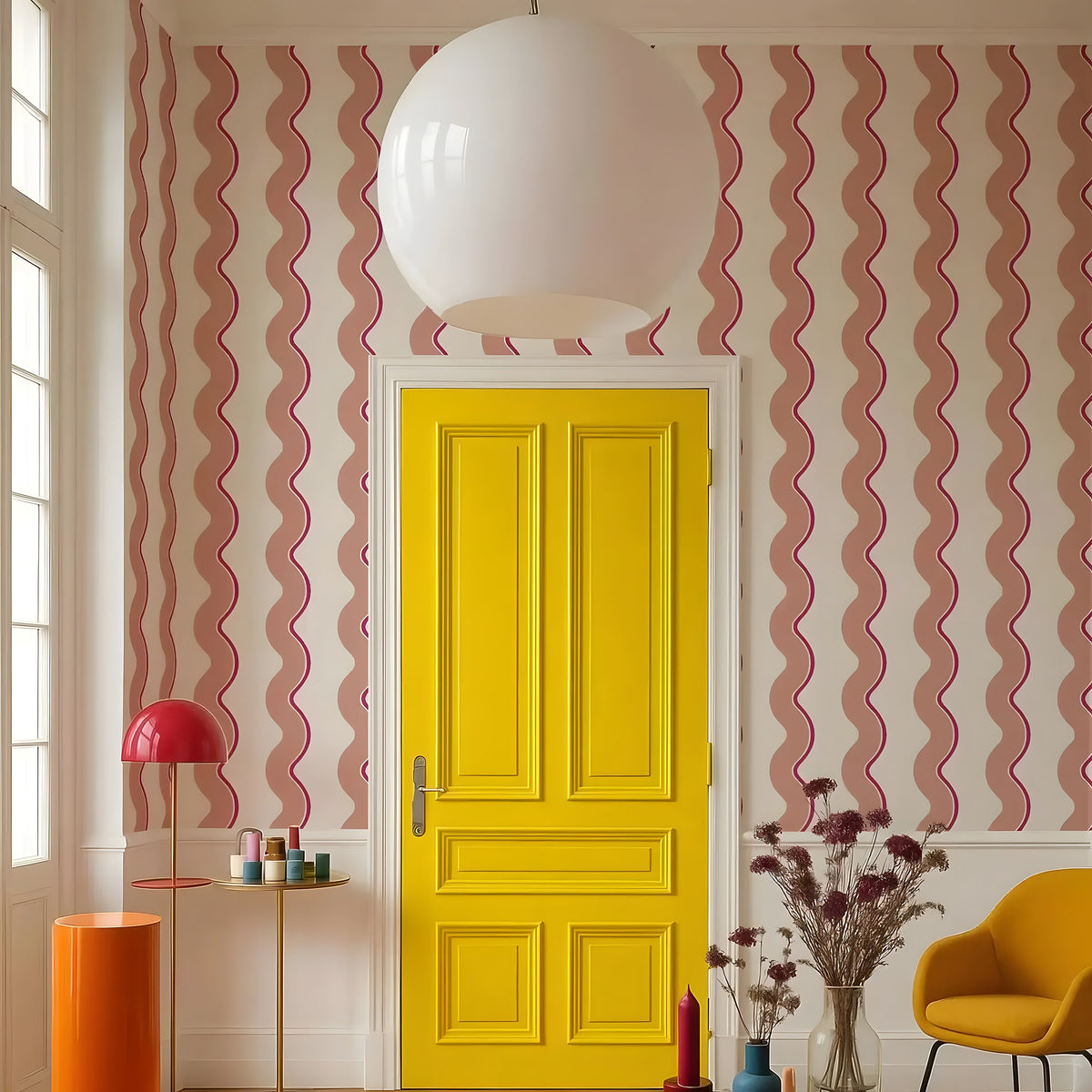 Yellow door with pink wavy-patterned walls, red lamp, and orange table in a room.