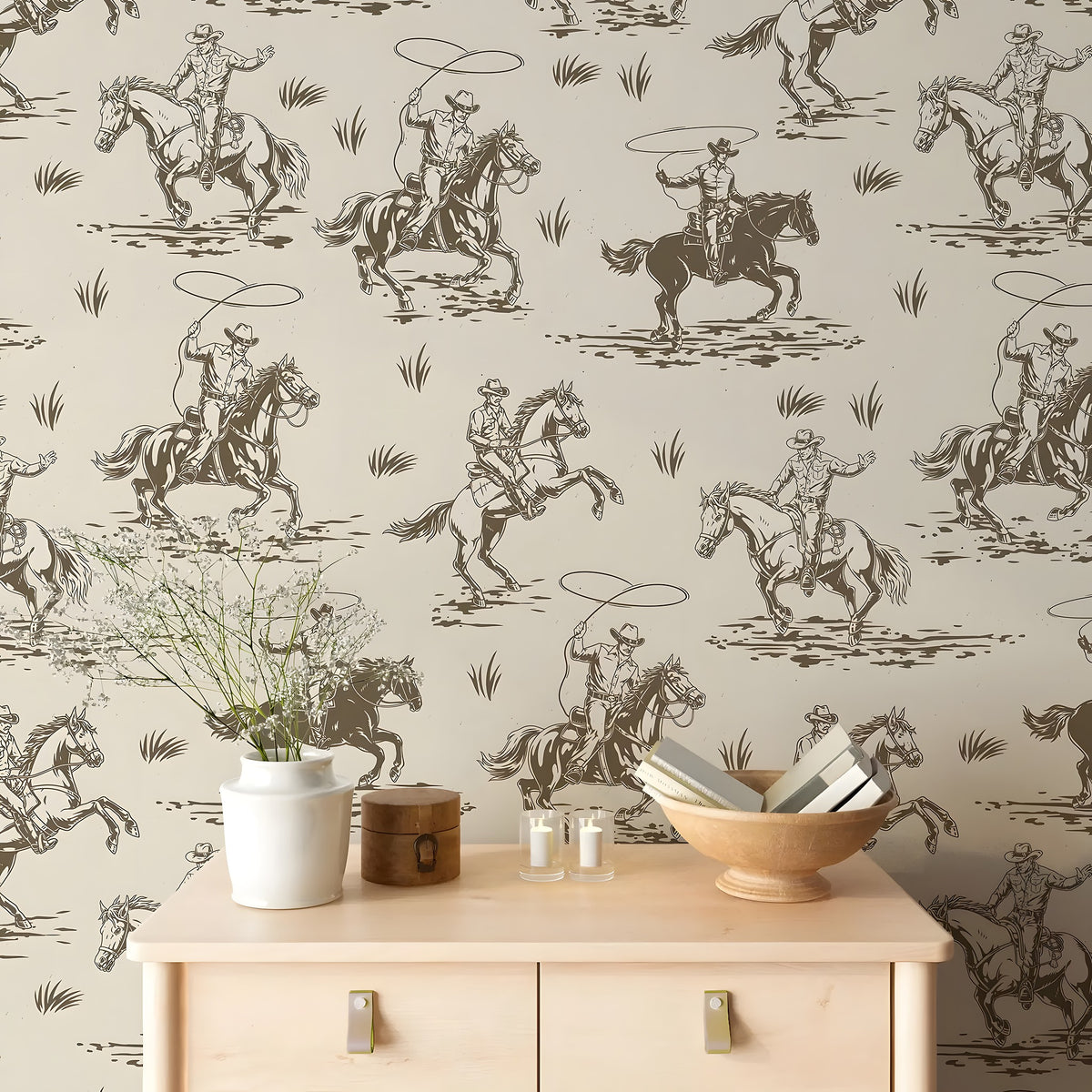 Wallpaper with cowboy and horse pattern in a room with a wooden cabinet and decor items.