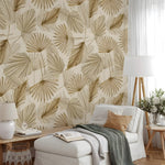 Living room with leaf-patterned wallpaper, white sofa, and decorative items.