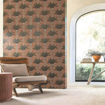 Living room with a patterned wall, chair, and table near a large window.