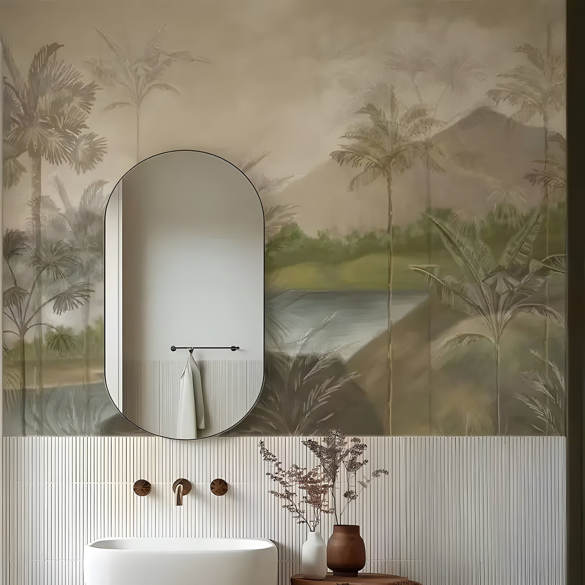 Bathroom with oval mirror, sink, and decorative elements against a tropical-themed wallpaper.