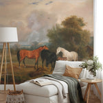 Living room with a mural of horses in a field on the wall, featuring a sofa, lamp, and decorative items.