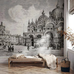 Room interior with a large wall mural of a historical cityscape.