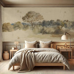 Neatly made bed in a bedroom with landscape wall art