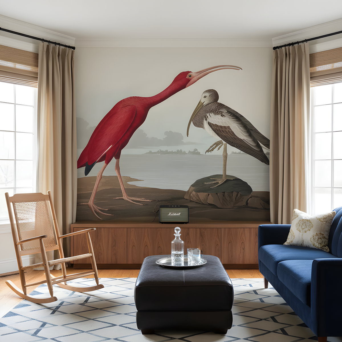 Living room with a large wall mural of two birds, a blue sofa, and a rocking chair.